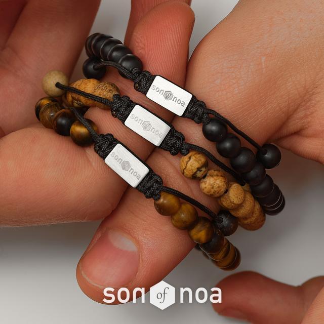son of noa stone bracelet with matte and brown pearls and silver details on the hand. Model 80980010000