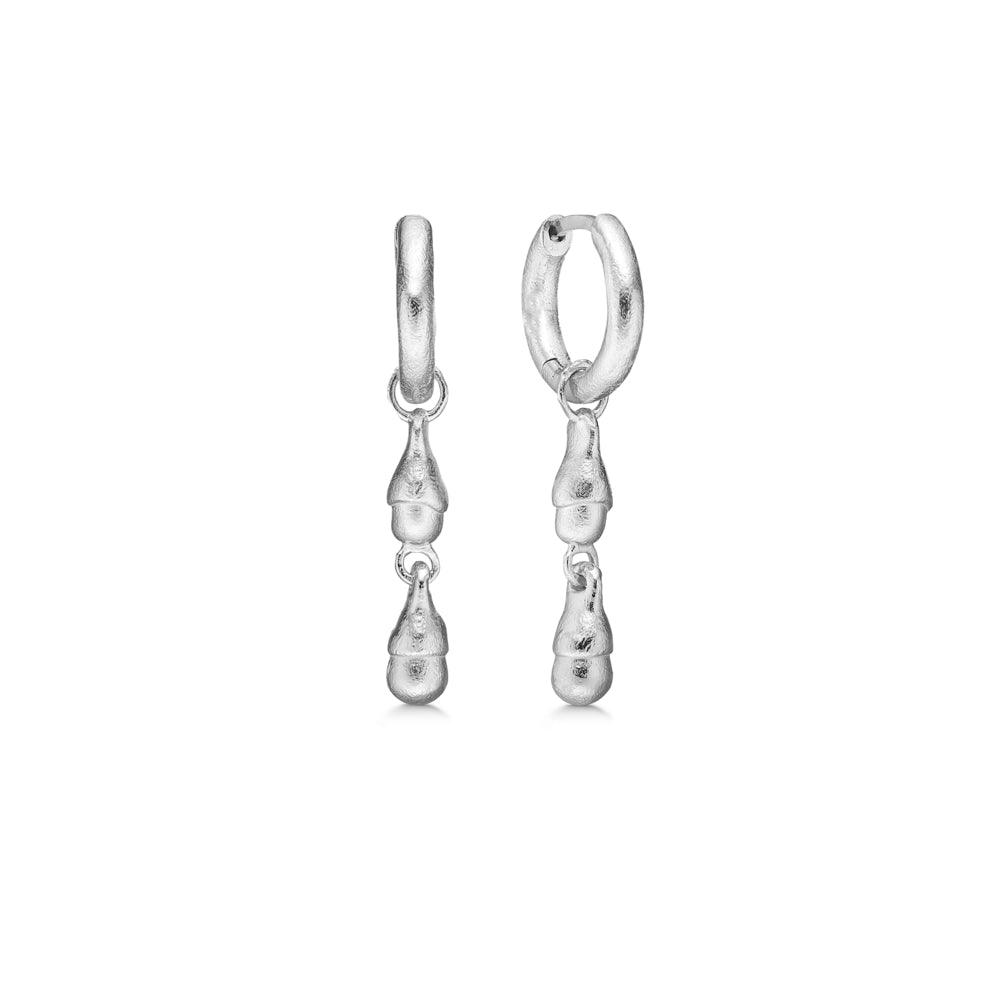 Studio Z Acorn Silver Hoops shows a pair of polished, textured earrings in silver, model 7110874-1.
