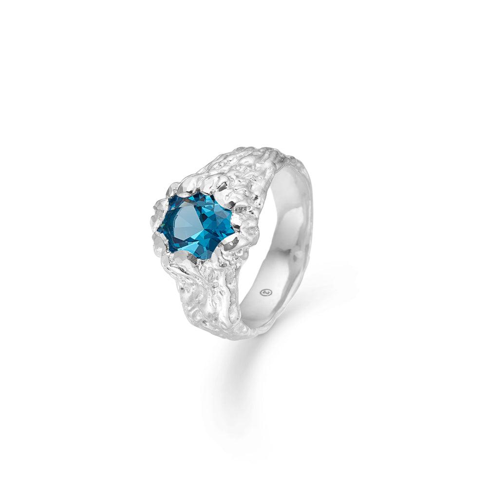Studio Z Forest Ring showcases a silver colored ring with blue faceted stones and organic structure. Model 7147848-001.