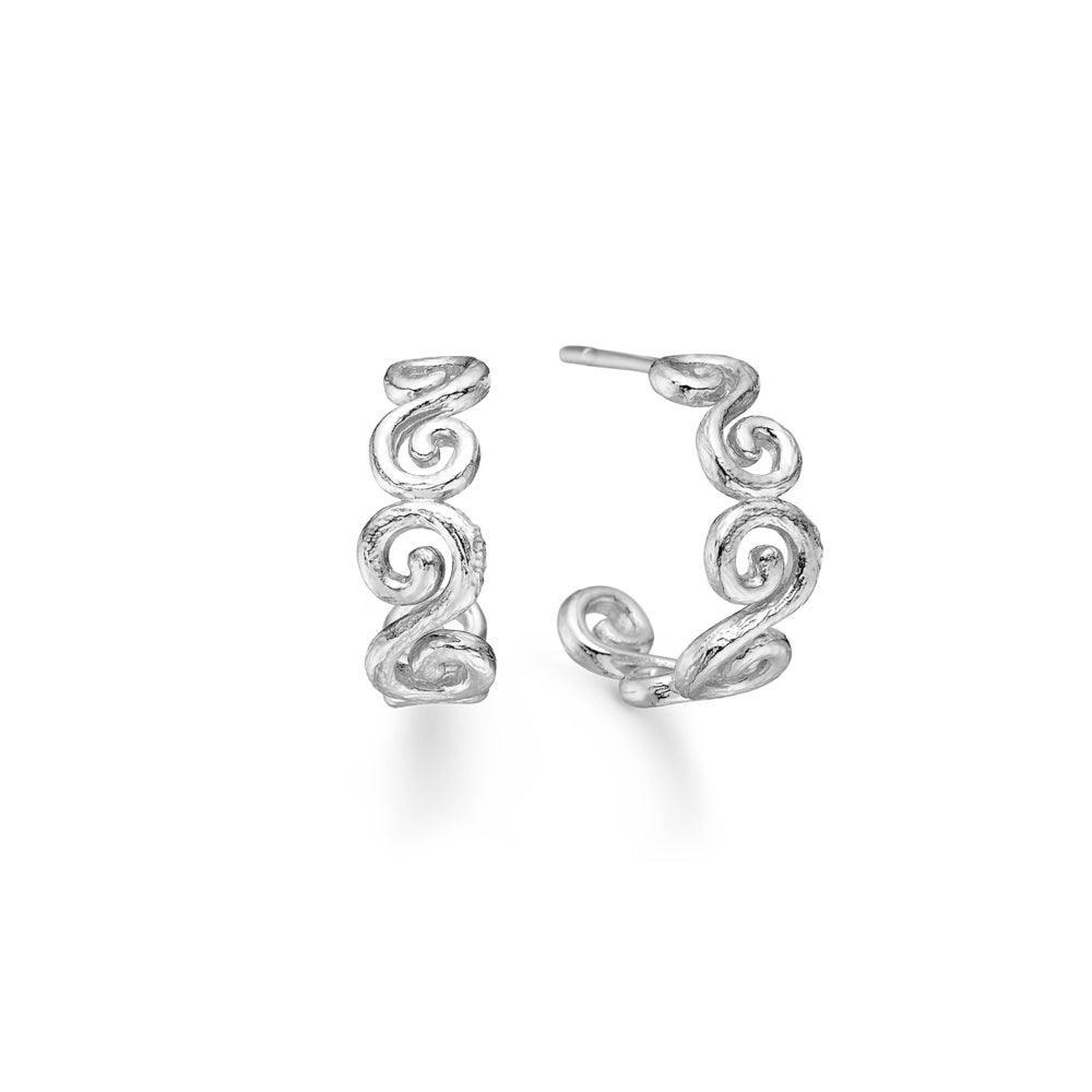 Curiosity Creol earrings feature detailed, silver-toned spiral designs as half rings. Model 7110870-1