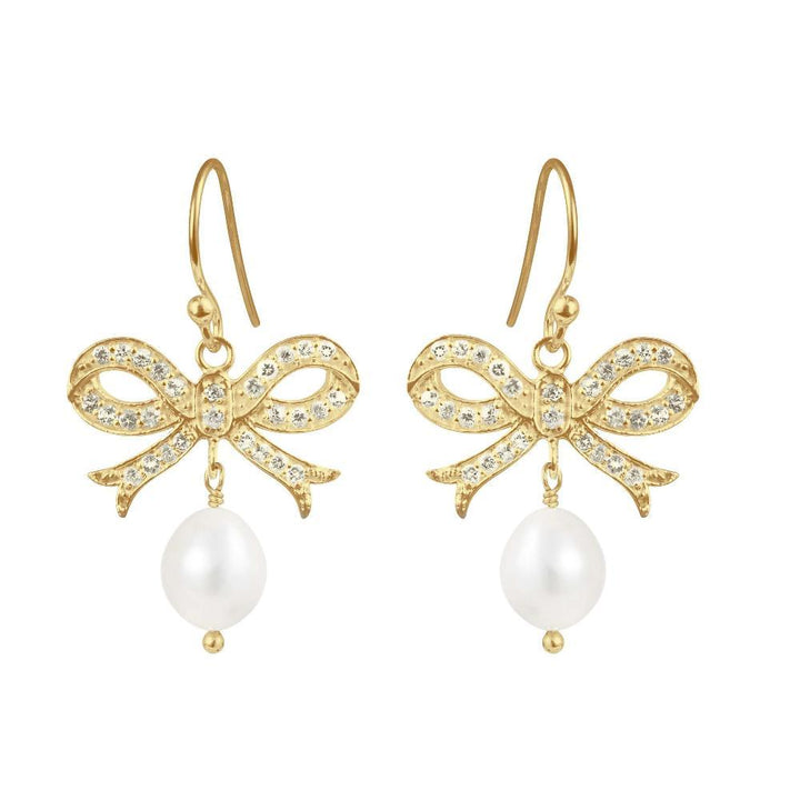 Susanne Friis Bjørner gold-plated earrings with bow, decorated with clear stones and pearls, Model 5067-2-900-1.