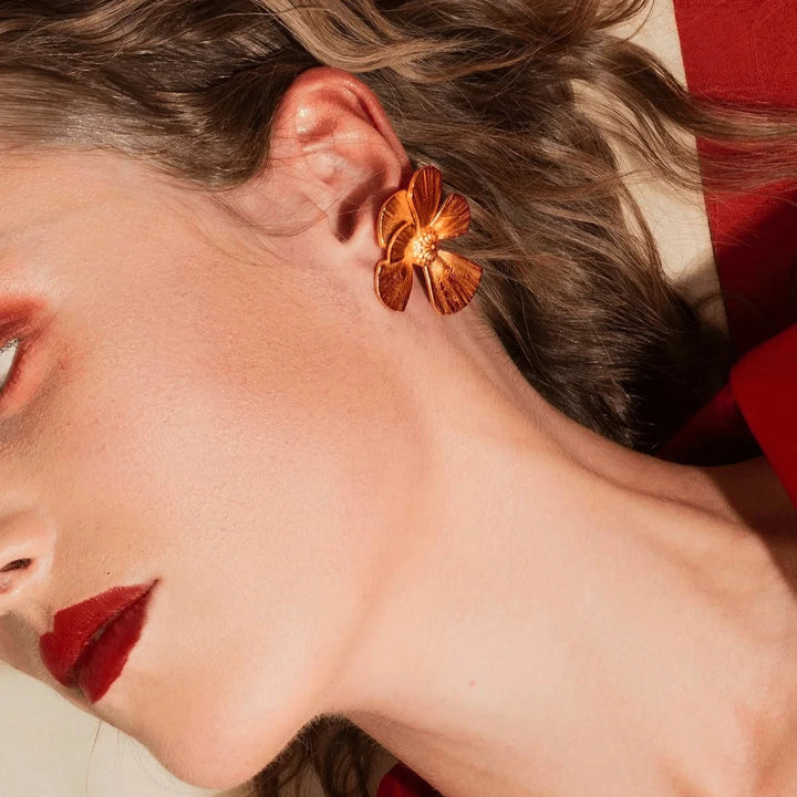 Vincent Wildflower Ample Earrings Gold Plated shown on model, floral design in golden metal. Model VJ190-UEG-1