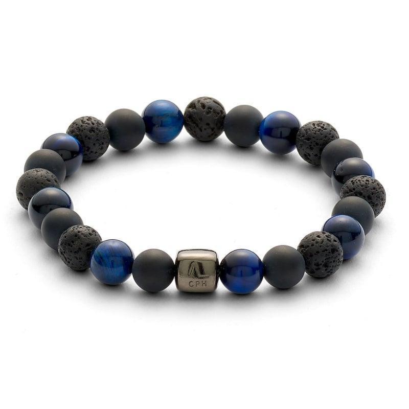 Alexander Lynggaard Bracelet Paris 8mm shows elastic bracelet with black lava beads and blue stones. Model c10113-001.