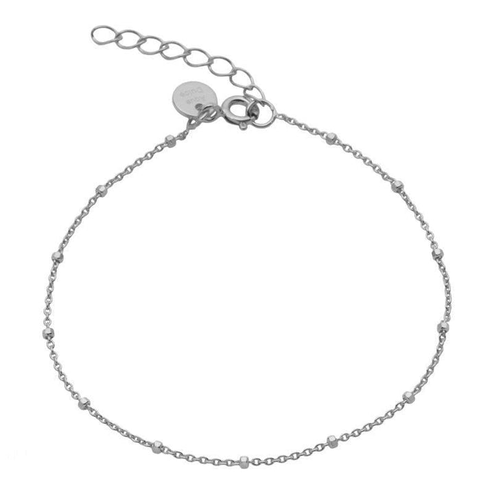 Aqua Dulce Dee Dot Bracelet Silver shows a simple, adjustable silver chain bracelet with small ball details. Model 1468-1468-1