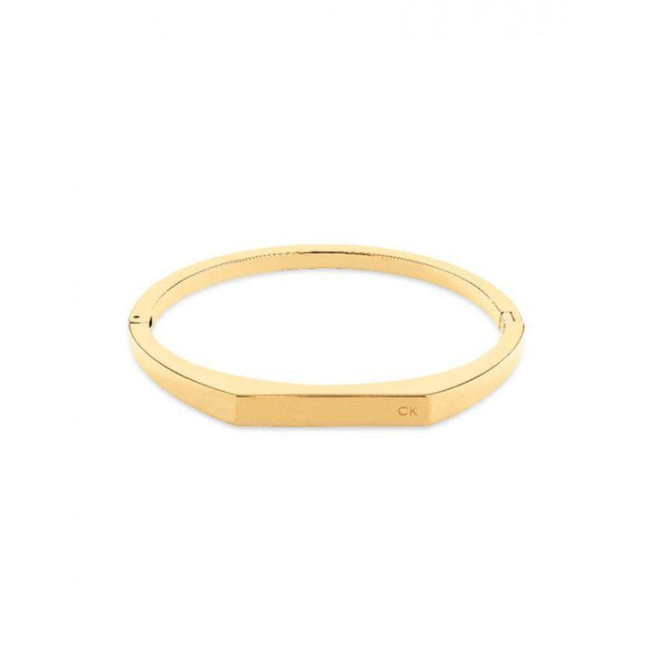 Calvin Klein Faceted Bar Bangle Black Gold, elegant faceted gold bangle with smooth surface. Model 35000046-35000046