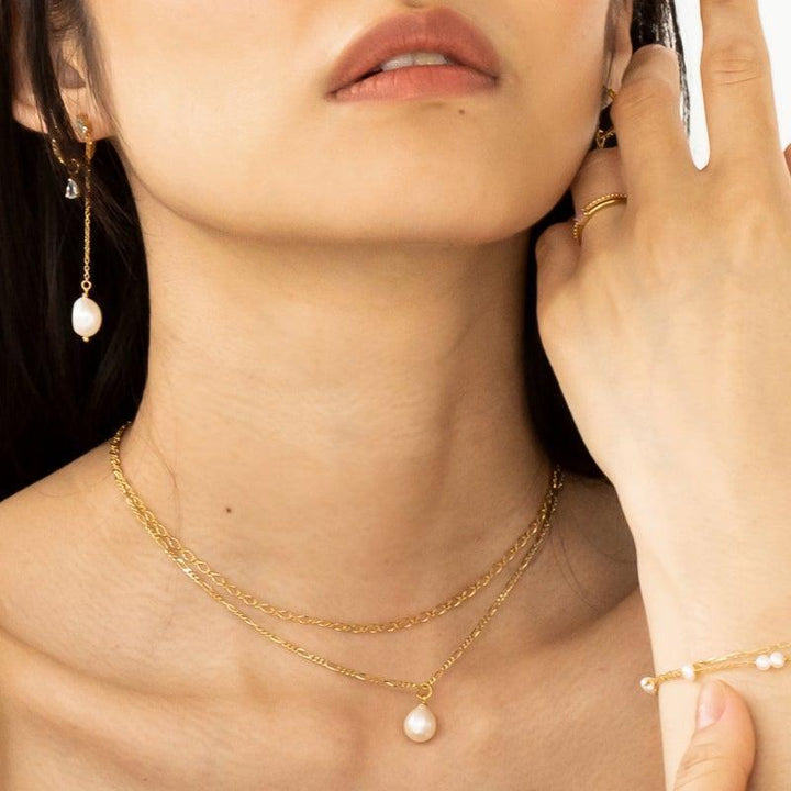 Carre necklace in gold plated silver shown on model, fine chain with pearl pendant. Model FC4329-FC4329-2