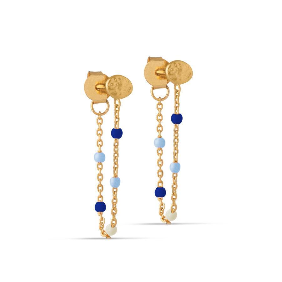 enamel-lola-earrings-navy-gold-plated shows a pair of silver-plated earrings with navy blue and light blue pearls. Model e140gm-marine-1