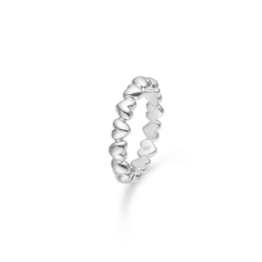 Mads Z Poetry Heart Ring in silver with heart-shaped links is seen on a white background. Model 2140028-001