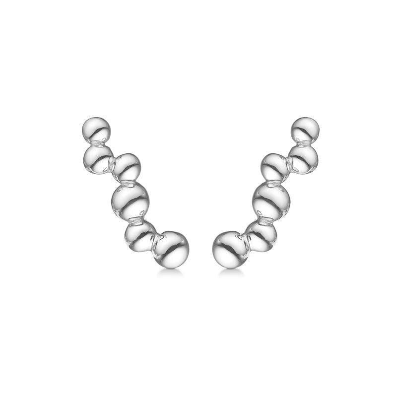 Mads Z silver earrings Embedded Ball shows two modern, curved silver earrings with a glossy surface. Model 2110084-1.