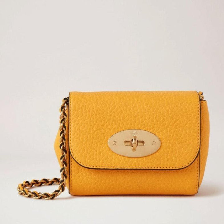 Mulberry Mini Lily Double Yellow is presented here in textured yellow leather with a gold chain strap. Model rl7749736p677-1