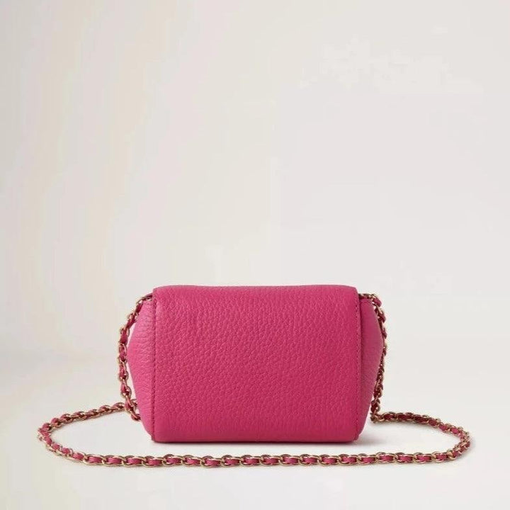 Mulberry Mini Lily mulberry pink shows an elegant, small shoulder bag in pink leather with a gold chain. Model RL7749736J191
