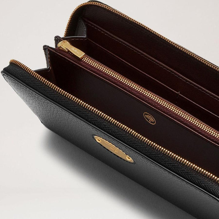 Mulberry Wallet Plaque 8 Card Zip Purse Small Classic Grain Black shows detail of black leather wallet with golden zipper interior. Model RL5676013A100.
