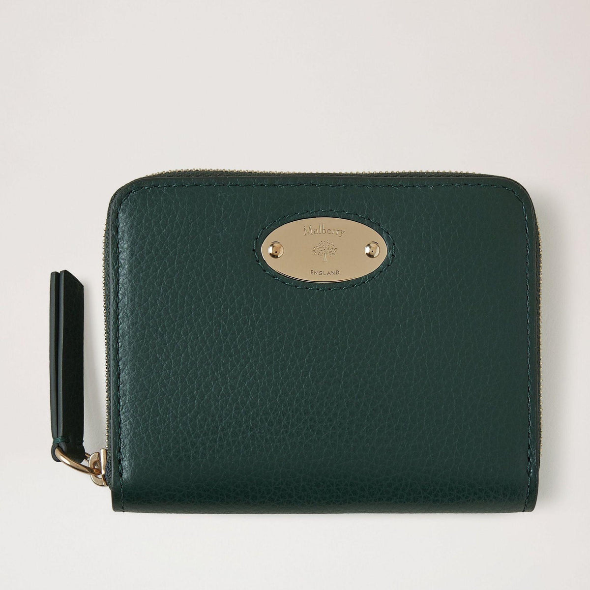 Mulberry Wallet Plaque Small Zip Wallet in dark green leather with gold-colored plate on the front. Model RL5680-205Q633