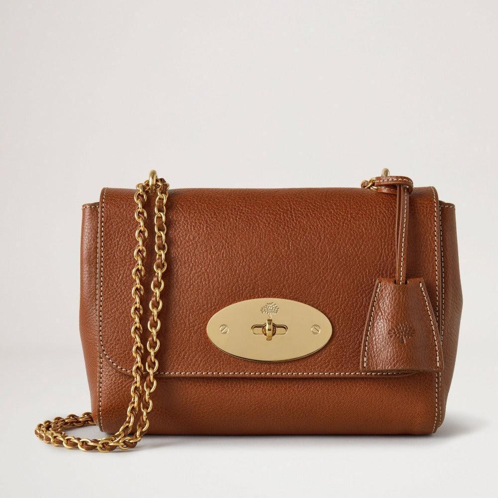 Mulberry Bag Lily Legacy NVT shows a brown leather shoulder bag with gold chain and gold clasp. Model HH7945275G110
