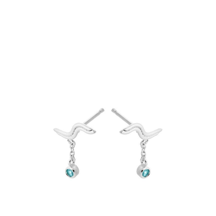 Pernille Corydon Hellir earrings show silver colored earrings with wavy shape and blue stones. Model E-462-S.
