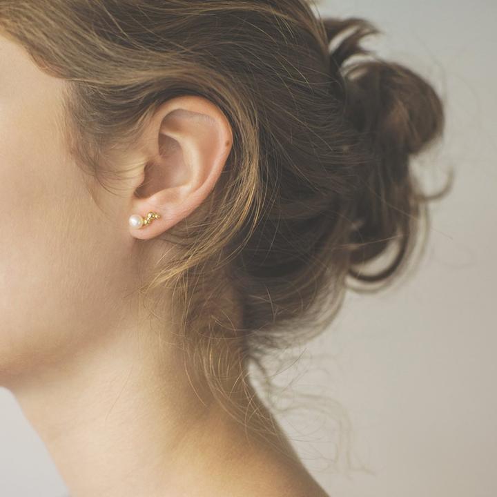 Polar Jewelry Bubble Gold Plated Earring Right shown worn on ear, elegant gold finish with pearl detail. Model WP-00110-2