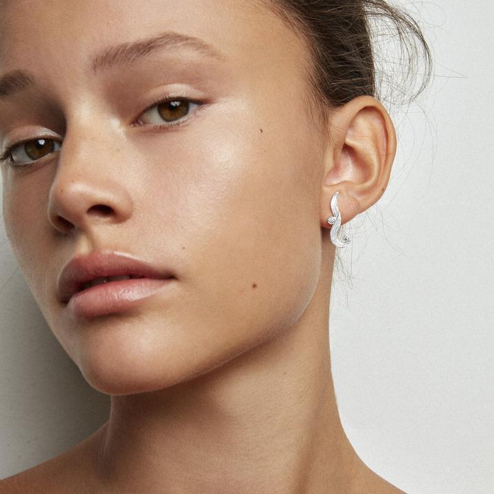 Polar Jewelry The Darning Needle silver earring shown worn by model in close-up, Model sl-wz-00309-2