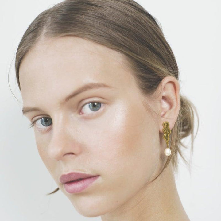 Polar Jewelry The Empress Gold Plated Earrings shown on model with pearl detail and organic shape, Model TEM-HS-GD-WP-00205-2