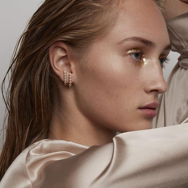 Polar Jewelry The Hierophant forg. earring in gold with stone worn by woman, Model thi-st-gd-wz-00240-2