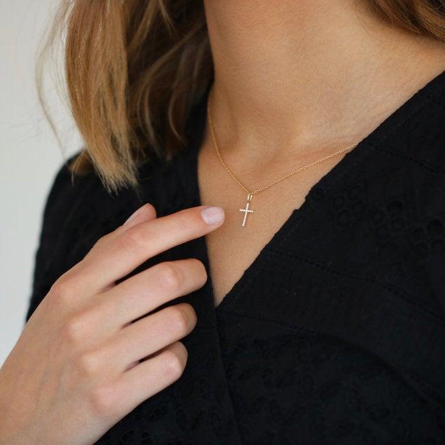 RO Copenhagen 18kt Rock Classic Diamond Cross Pendant white gold hangs on necklace, worn by woman. Model 106257-2