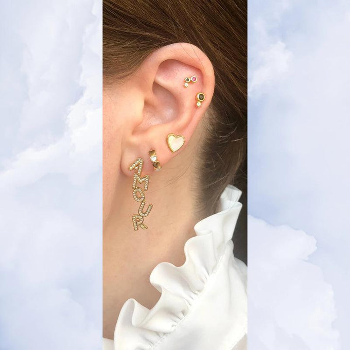 Cora Huggie Earring shows elegant gold huggie with clear stones on ear, glamorous look, Model SS2216-SS2216-2